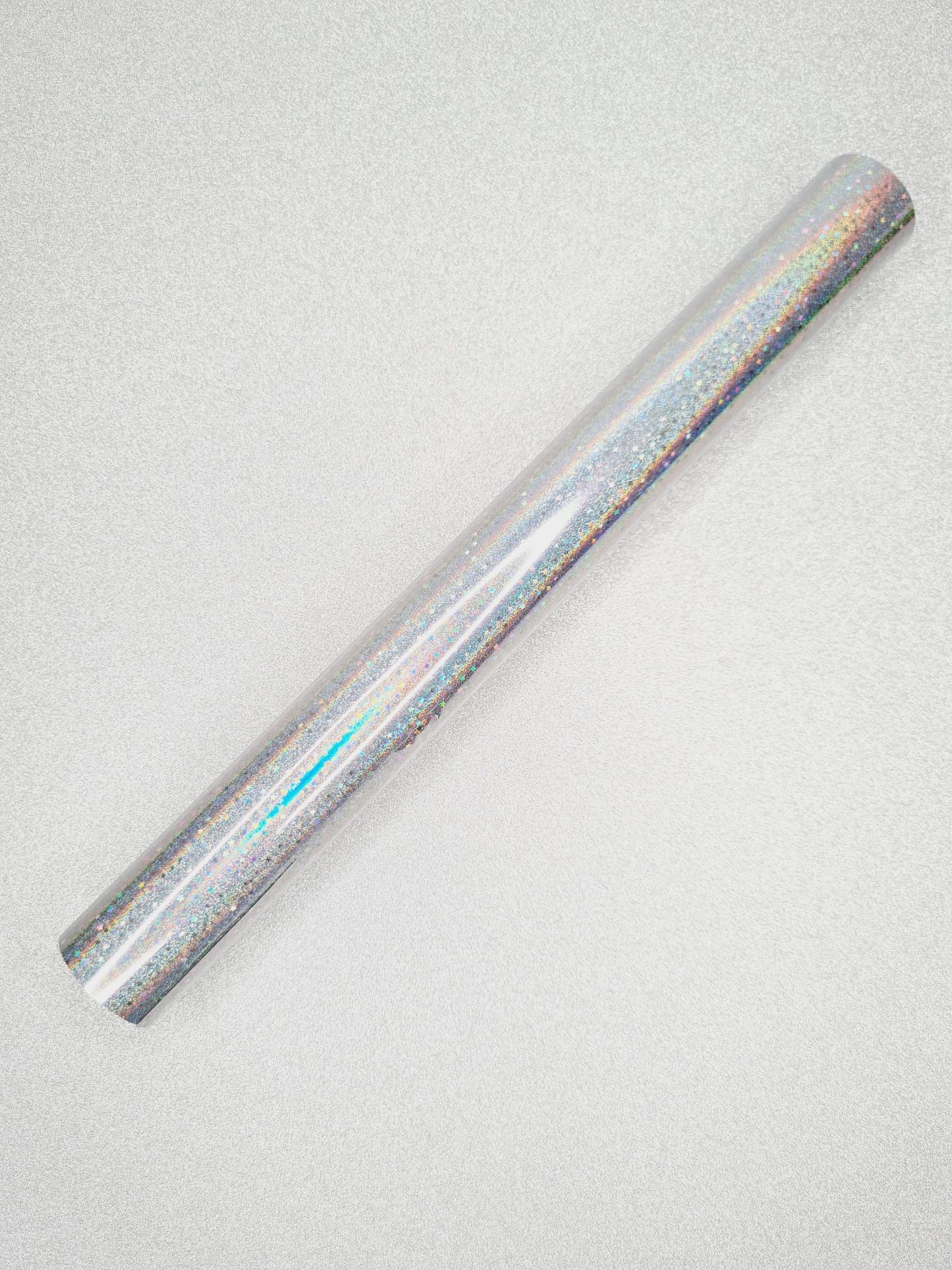 Roll of holographic vinyl on a light gray background